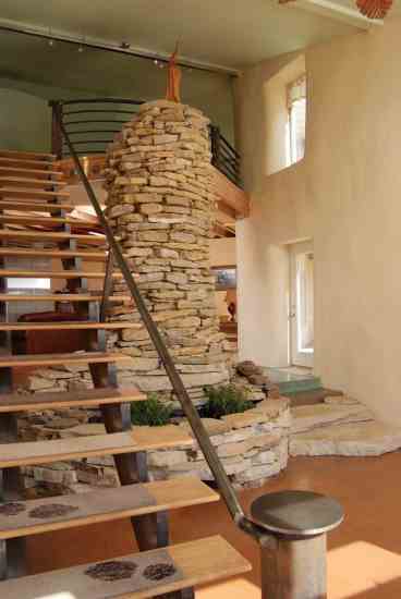Built of stone quarried just seven miles from the site, the two-story fountain provides a focal point and represents architect Mark Grantham's desire to incorporate whimsy and the natural world into the home.